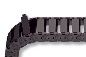 The black MONO 0180.10 plastic cable carrier, shown partially open to reveal its flexible, interlocking segments, is displayed against a white background—resembling models from Reiku.